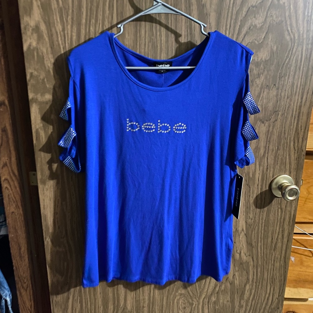Womens BEBE top blue in color size 1x